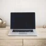 Open laptop on a desk for computer buying decisions