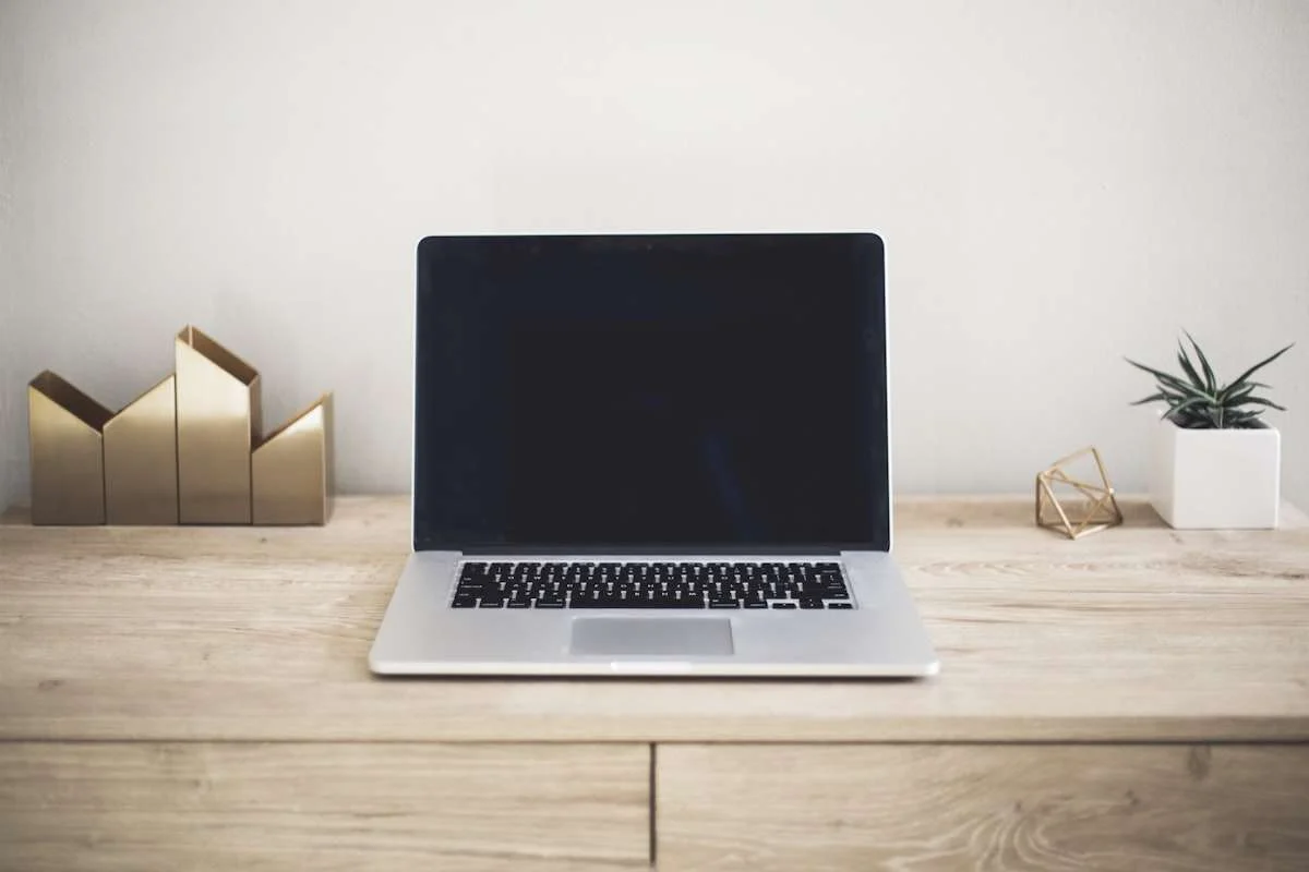 Open laptop on a desk for computer buying decisions